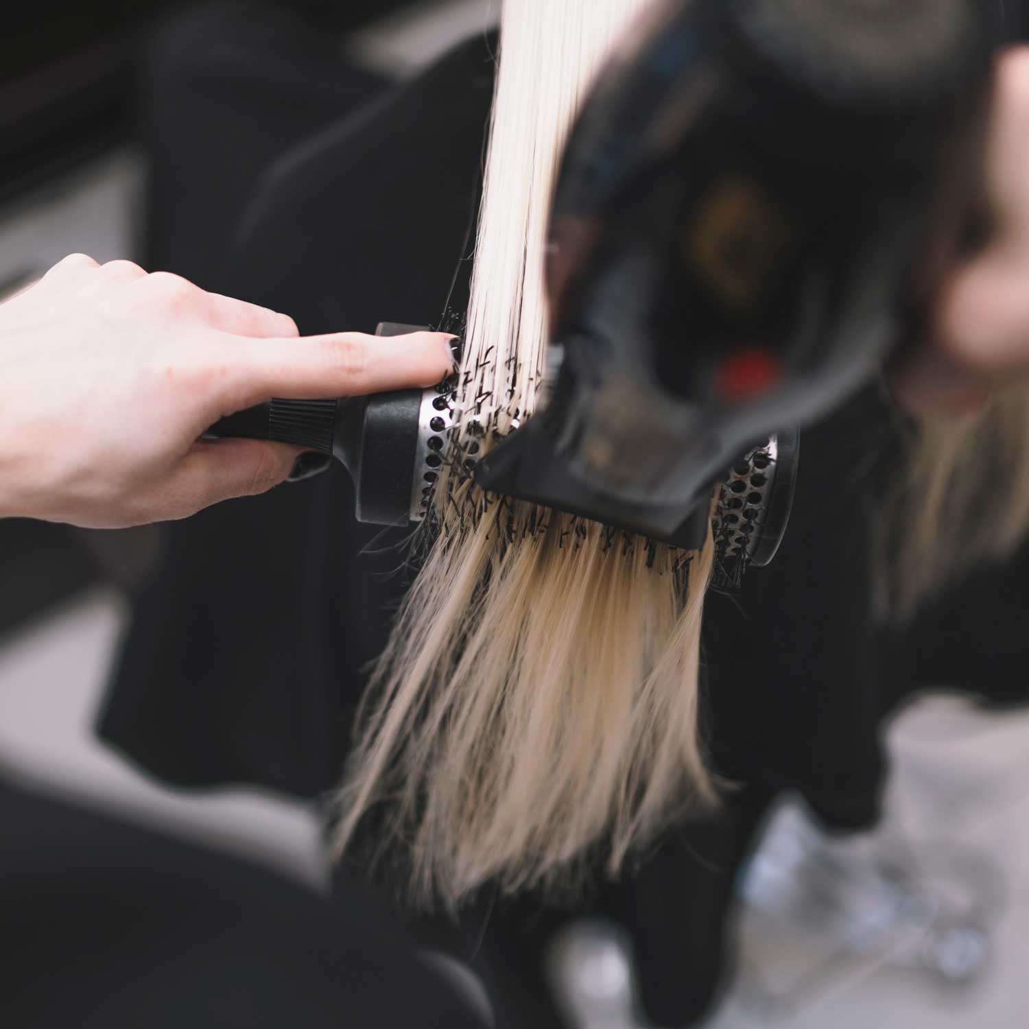 crop-stylist-setting-hair-with-brush